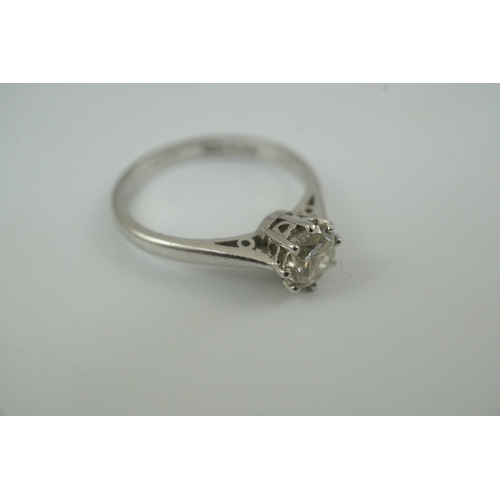 200 - A modern platinum and solitaire diamond set ring, the round brilliant cut stone weighing approximate... 