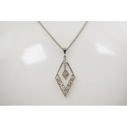 208 - A 1940's white gold? and millegrain set diamond cluster drop pendant, of diamond shape, overall 32mm... 