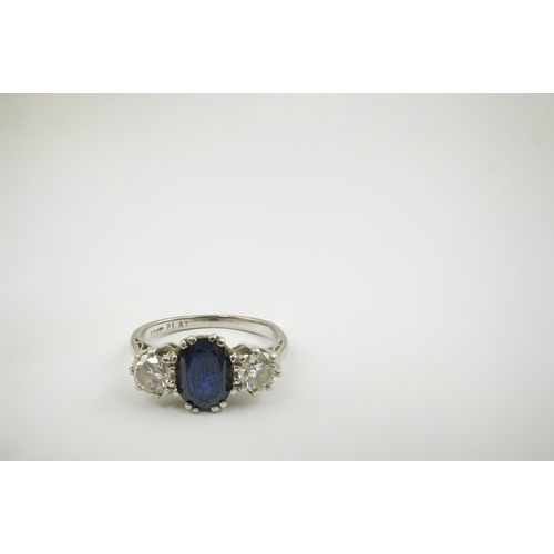 209 - An 18ct white gold and platinum, single stone oval cut sapphire and two stone round cut diamond set ... 