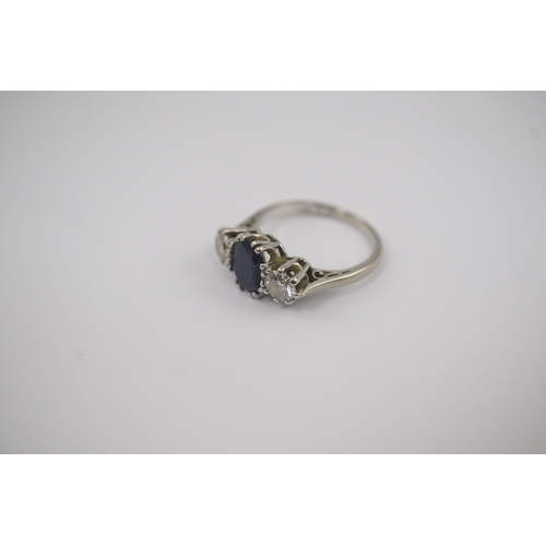 209 - An 18ct white gold and platinum, single stone oval cut sapphire and two stone round cut diamond set ... 