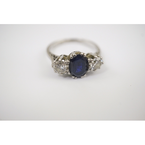 209 - An 18ct white gold and platinum, single stone oval cut sapphire and two stone round cut diamond set ... 