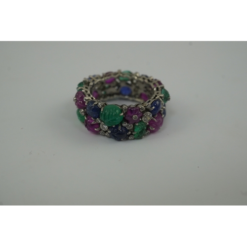 212 - A Mauboussin style platinum, ruby, emerald, sapphire and diamond set 'Tutti Frutti' ring, the colour... 