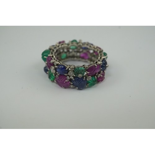 212 - A Mauboussin style platinum, ruby, emerald, sapphire and diamond set 'Tutti Frutti' ring, the colour... 