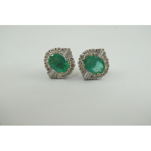 213 - A pair of Art Deco style white gold, emerald and diamond cluster earrings, set with oval cut emerald... 