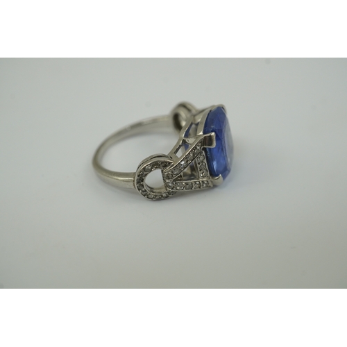 215 - A mid to late 20th century platinum and single stone tapered cushion cut sapphire set dress ring, wi... 