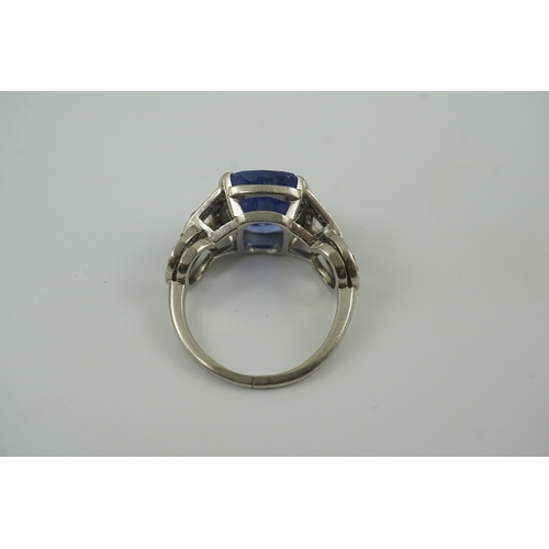 215 - A mid to late 20th century platinum and single stone tapered cushion cut sapphire set dress ring, wi... 