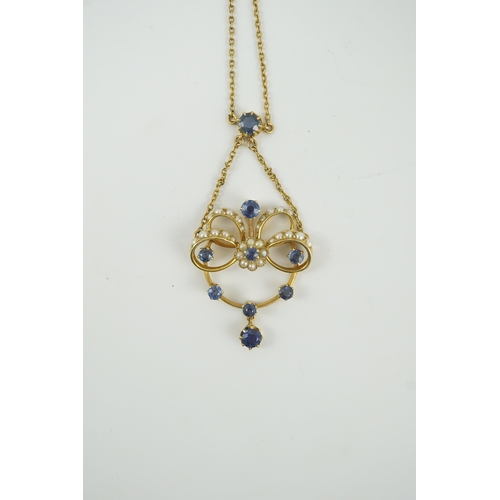 216 - A mid 20th century gold, sapphire and seed pearl cluster set drop pendant necklace, 46cm, gross weig... 