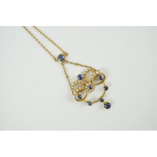 216 - A mid 20th century gold, sapphire and seed pearl cluster set drop pendant necklace, 46cm, gross weig... 