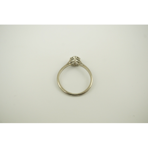 218 - A platinum? and solitaire diamond set ring, the stone weighing approximately 0.90ct, size P/P, gross... 