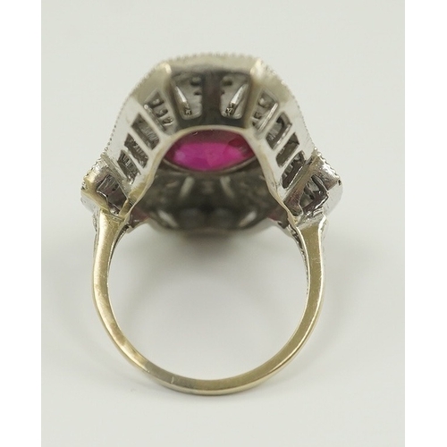 219 - A gold, cabochon ruby and diamond cluster set upfinger ring, in a 'filigree' setting, size N, gross ... 