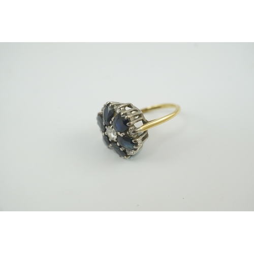 221 - A 1970's 18ct gold, sapphire and diamond set circular cluster ring, size K/L, gross weight 5.1 grams... 