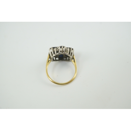 221 - A 1970's 18ct gold, sapphire and diamond set circular cluster ring, size K/L, gross weight 5.1 grams... 