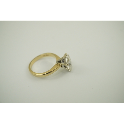 226 - A modern 14k gold and solitaire marquise diamond set ring, the stone weighing approximately 2.75cts,... 