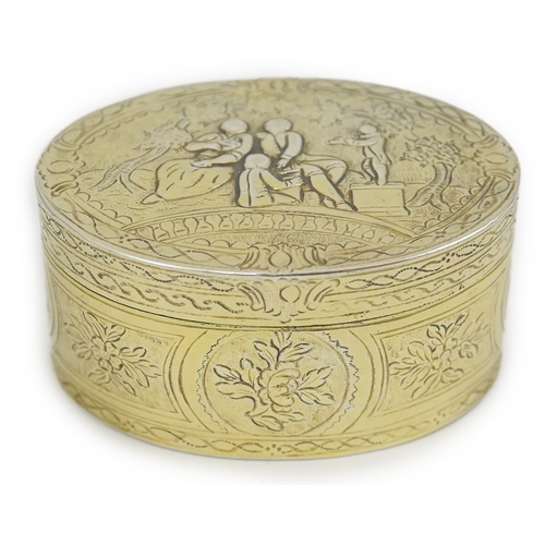 23 - A 19th century Continental silver gilt oval snuff box, embossed with foliage, the cover with figures... 