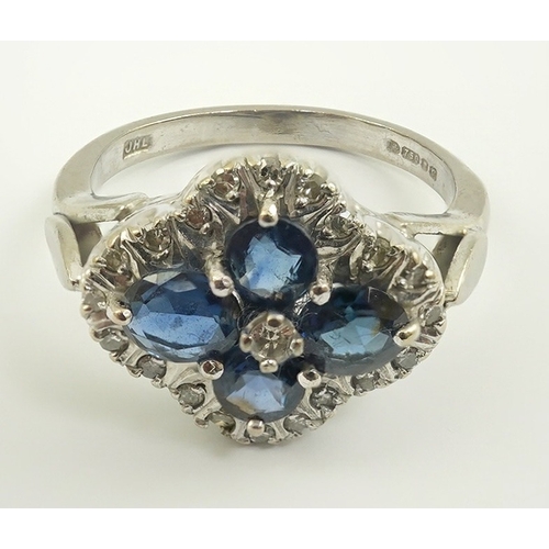 232 - A modern 18ct white gold, sapphire and diamond cluster set ring, of quatrefoil shape, size P/P, gros... 