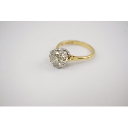 239 - A modern 18ct gold and solitaire round cut diamond set ring, the stone weighing approximately 3.00ct... 