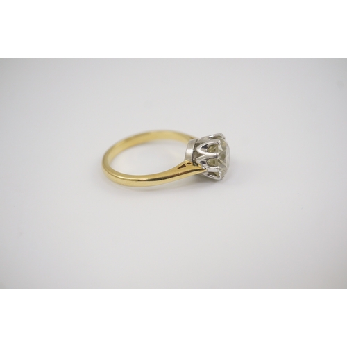 239 - A modern 18ct gold and solitaire round cut diamond set ring, the stone weighing approximately 3.00ct... 