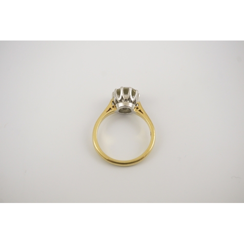 239 - A modern 18ct gold and solitaire round cut diamond set ring, the stone weighing approximately 3.00ct... 