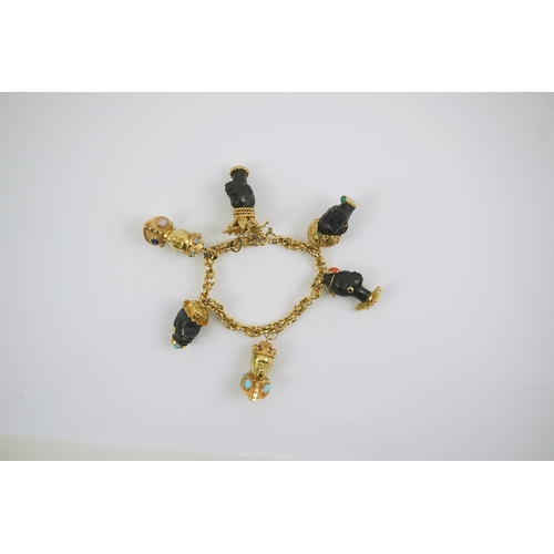 243 - A late 20th century Italian 18k gold charm bracelet, hung with six assorted Italian 18k gold and gem... 