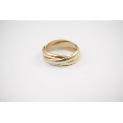 245 - A modern Must De Cartier three colour 18k gold triple band 'Russian' wedding ring, signed and number... 