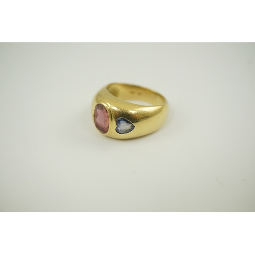 251 - A modern Mappin & Webb 18ct gold and gypsy set pink tourmaline and blue sapphire set dress ring, siz... 