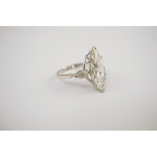 254 - A modern 18ct white gold and single stone marquise cut diamond set ring, with two stone marquise cut... 