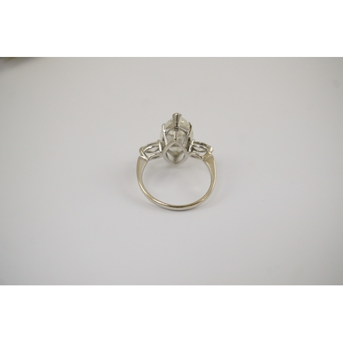 254 - A modern 18ct white gold and single stone marquise cut diamond set ring, with two stone marquise cut... 