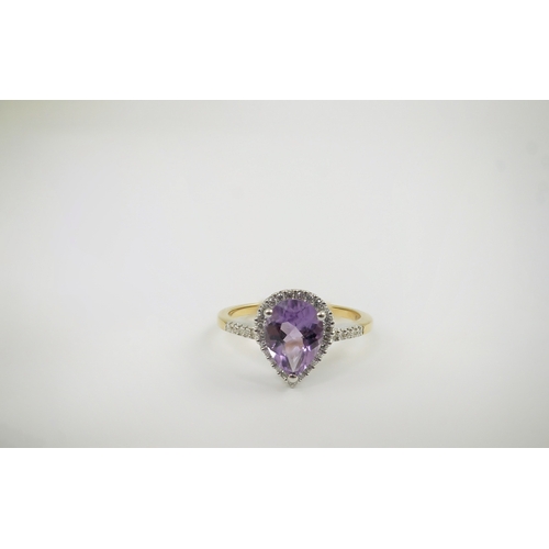 256 - A modern 18ct gold and single stone pear cut amethyst set ring, with diamond chip set border and sho... 