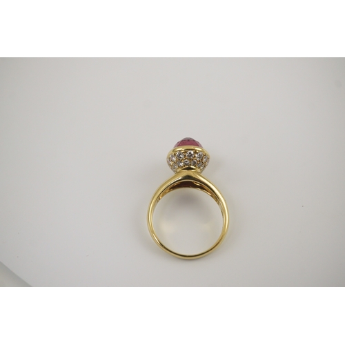 257 - A modern 18k gold and single stone fancy oval cut deep pink tourmaline set dress ring, signed Asprey... 