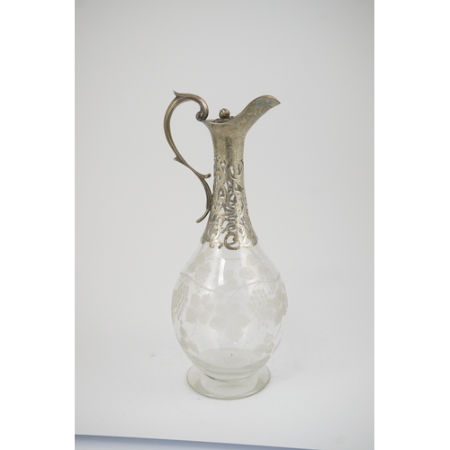 26 - A Victorian parcel gilt silver mounted glass pyriform claret jug, by Joseph Angell II, with etched f... 