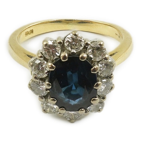 260 - A modern 18ct gold, sapphire and diamond set oval cluster ring, size K/L, gross weight 4.8 grams.... 