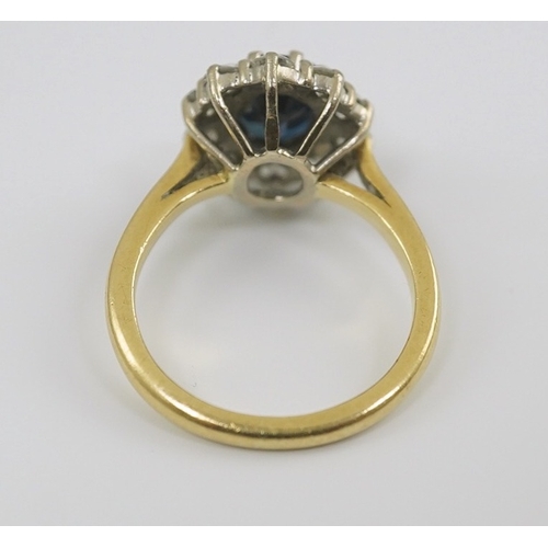 260 - A modern 18ct gold, sapphire and diamond set oval cluster ring, size K/L, gross weight 4.8 grams.... 