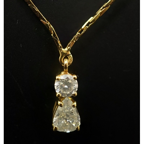 264 - A modern gold and two stone diamond pendant, set with pearl and round cut stones, 13mm, on an Italia... 