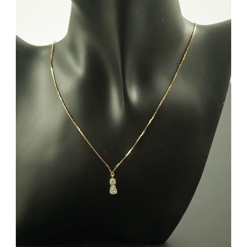 264 - A modern gold and two stone diamond pendant, set with pearl and round cut stones, 13mm, on an Italia... 