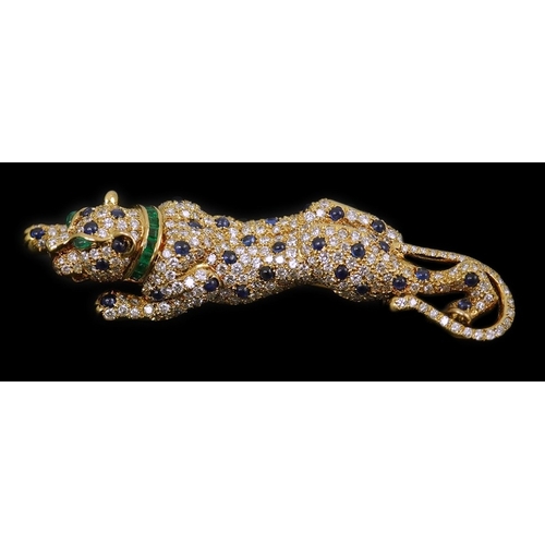 266 - A modern Cartier style 18k gold, sapphire, emerald and diamond cluster set stalking panther brooch, ... 