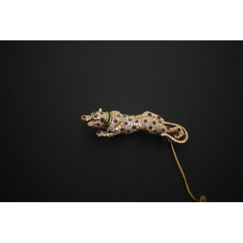 266 - A modern Cartier style 18k gold, sapphire, emerald and diamond cluster set stalking panther brooch, ... 