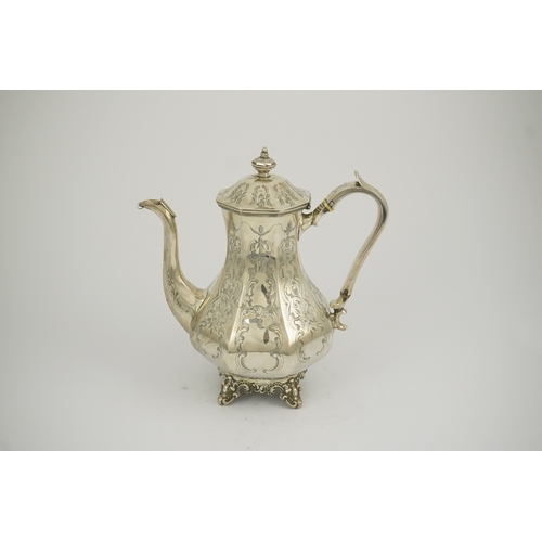 27 - A Victorian engraved silver coffee pot, by John Welby, of octagonal baluster form, on four scroll fe... 