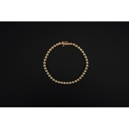 270 - A modern gold and forty five stone round cut diamond set tennis bracelet, 19cm, gross weight 10.3 gr... 