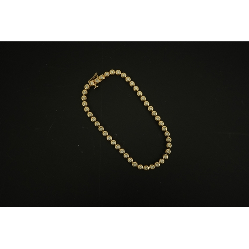 270 - A modern gold and forty five stone round cut diamond set tennis bracelet, 19cm, gross weight 10.3 gr... 