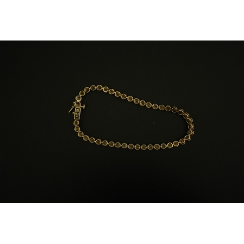 270 - A modern gold and forty five stone round cut diamond set tennis bracelet, 19cm, gross weight 10.3 gr... 