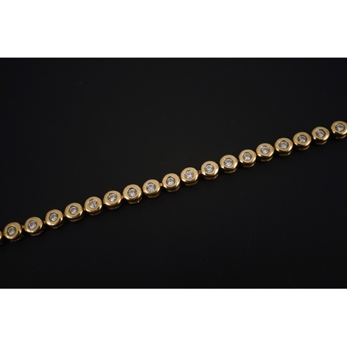 270 - A modern gold and forty five stone round cut diamond set tennis bracelet, 19cm, gross weight 10.3 gr... 