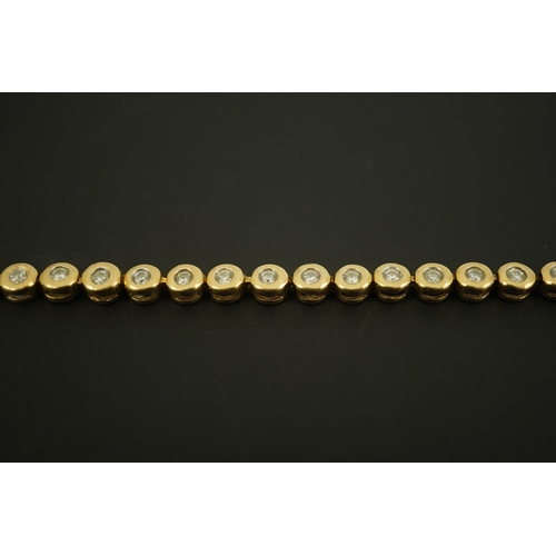 270 - A modern gold and forty five stone round cut diamond set tennis bracelet, 19cm, gross weight 10.3 gr... 