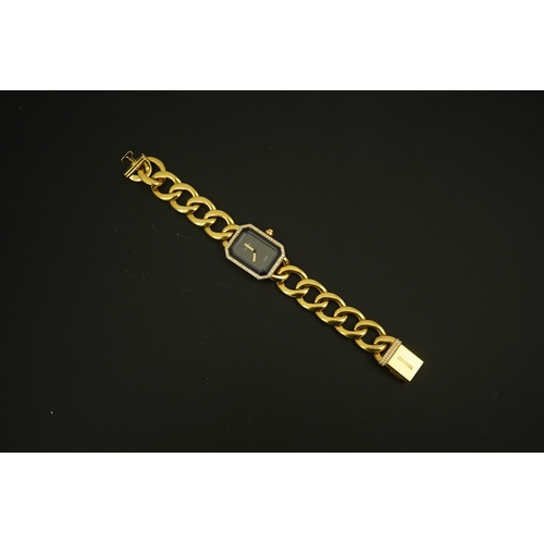 273 - A lady's modern 18ct gold and diamond set Chanel quartz wrist watch, on an 18ct gold Chanel oval lin... 