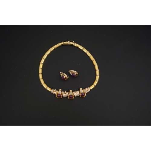 275 - A modern 18k gold, cabochon ruby, round and baguette cut diamond cluster set torque  necklace and a ... 