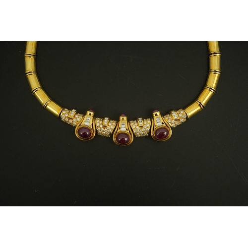 275 - A modern 18k gold, cabochon ruby, round and baguette cut diamond cluster set torque  necklace and a ... 