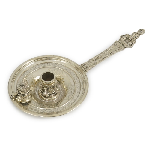 28 - An ornate Victorian silver Renaissance revival chamber stick, by George Fox, decorated with mask, fi... 