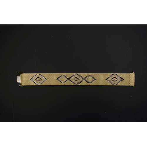 281 - A 1980's three colour 9ct gold bracelet, decorated with diamond shaped motifs, 18.7cm, 43.7 grams.... 