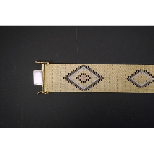 281 - A 1980's three colour 9ct gold bracelet, decorated with diamond shaped motifs, 18.7cm, 43.7 grams.... 