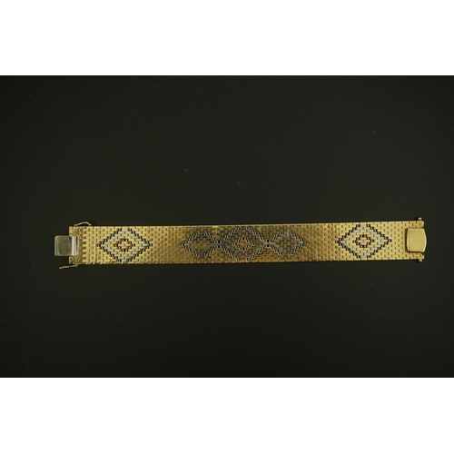 281 - A 1980's three colour 9ct gold bracelet, decorated with diamond shaped motifs, 18.7cm, 43.7 grams.... 