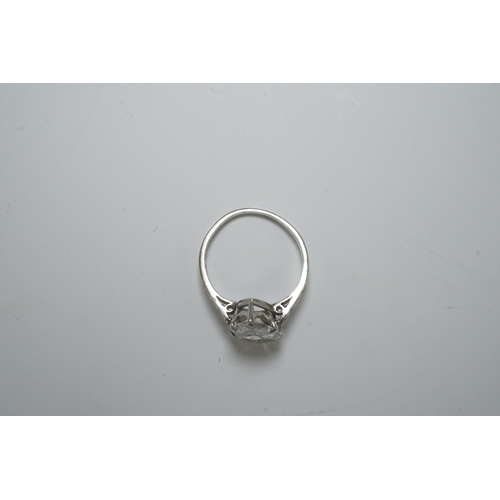 285 - A platinum and pear cut single stone diamond set ring, with diamond set shoulders, the stone weighin... 